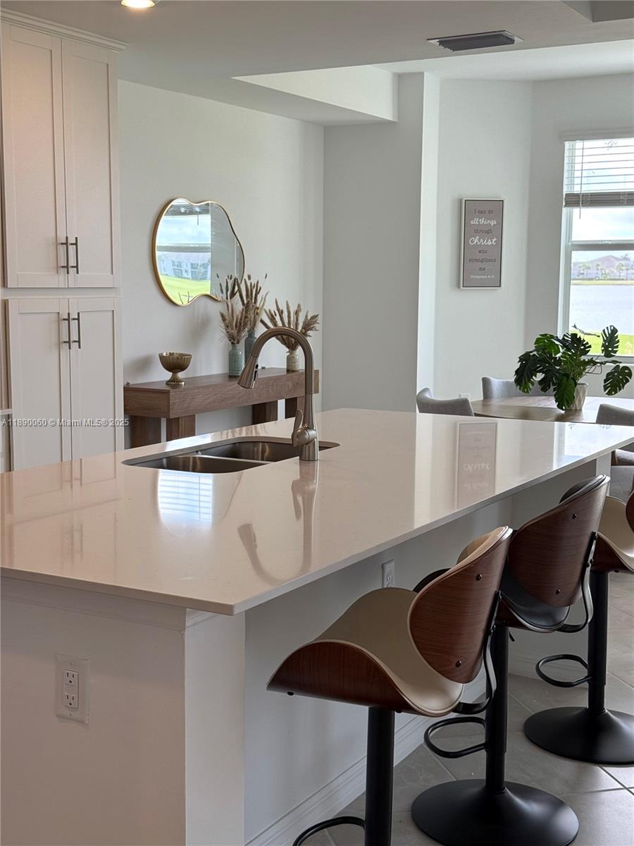 5555 Double Eager Circle, Unit 3917 Immokalee, FL 34142 - Photo 1 of 16 a dining room with table chairs and wooden floor