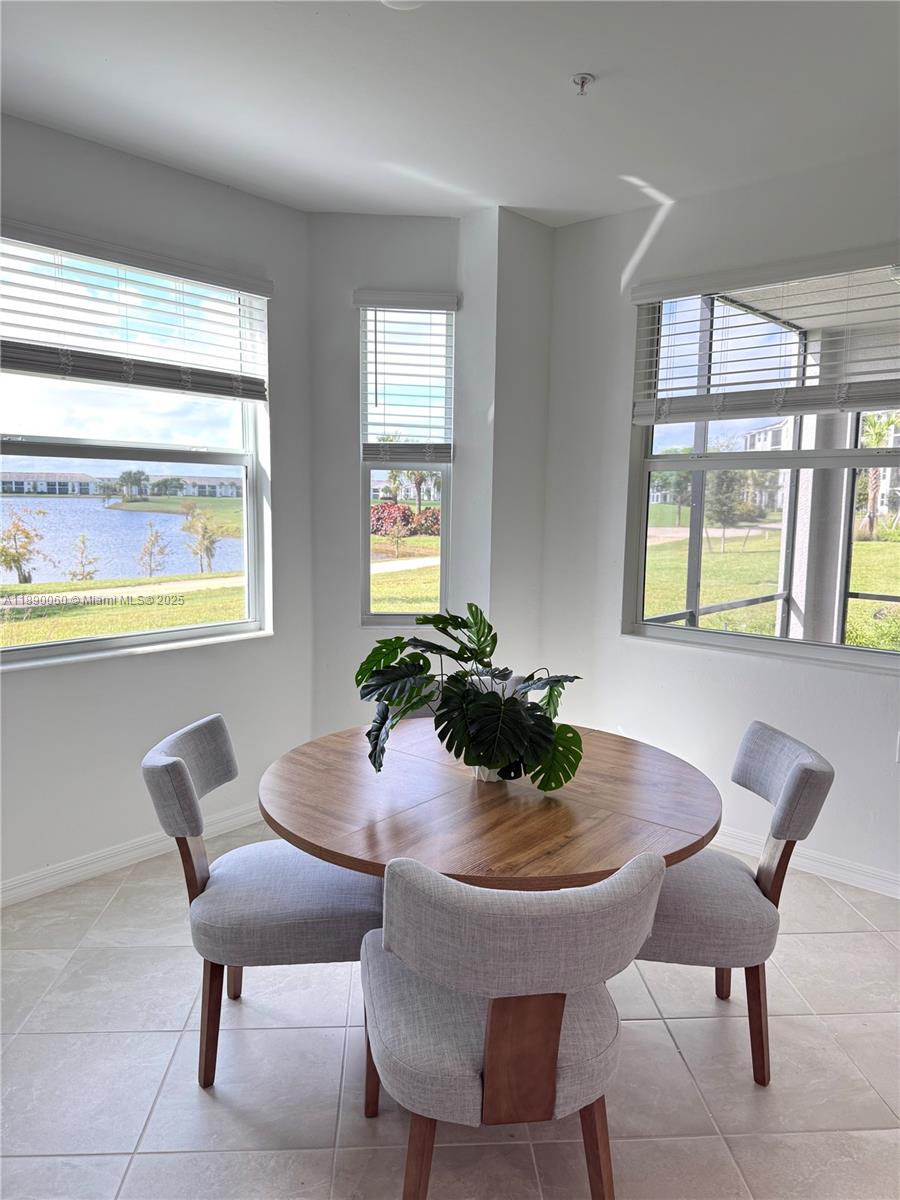 5555 Double Eager Circle, Unit 3917 Immokalee, FL 34142 - Photo 6 of 16 a dining room with furniture and window