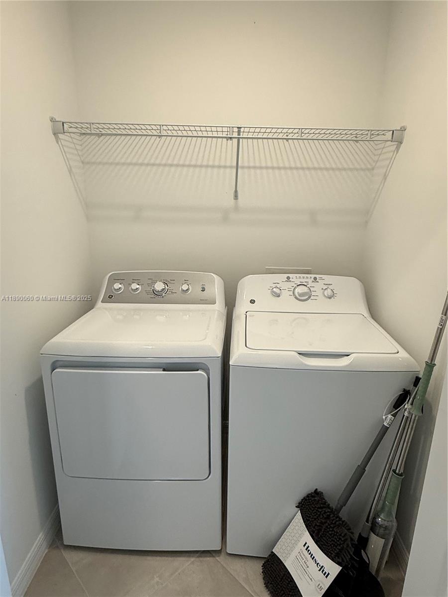 5555 Double Eager Circle, Unit 3917 Immokalee, FL 34142 - Photo 10 of 16 a utility room with dryer and washer