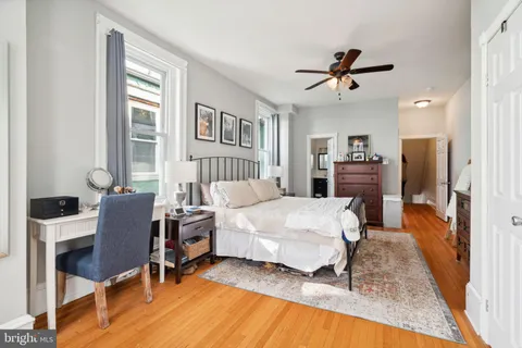 a bedroom with a bed and a chair