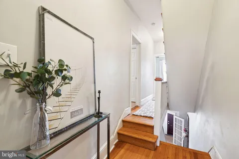 a view of an entryway with wooden floor