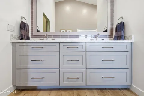 a bedroom with a bed and a dresser