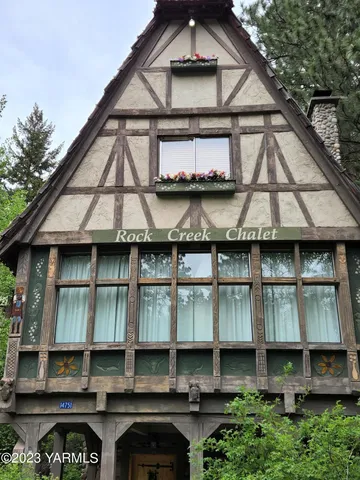 a backyard of a house with a fountain
