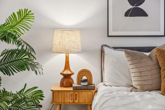 a bedroom with a large bed and a window