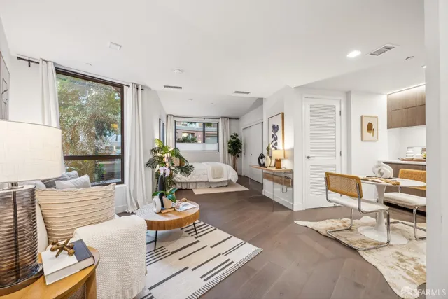 a living room with furniture and a table