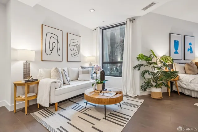 a living room with furniture and a table