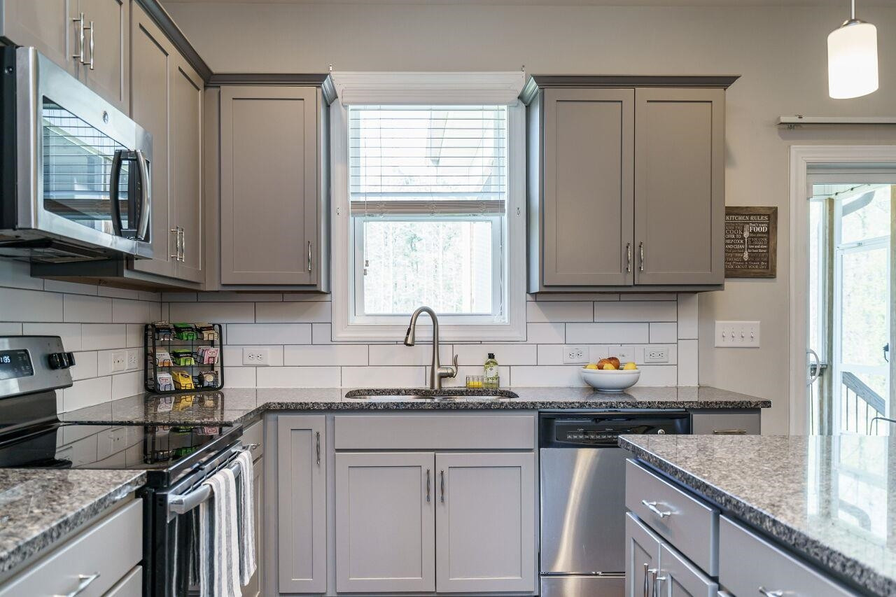1509 Yakimas Road Raleigh, NC 27603 - Photo 13 of 38 The kitchen also has a tile back splash as well as a spacious pantry. Kitchen