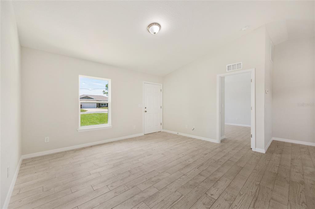 29 Olive Cir Loop Ocala, FL 34472 - Photo 15 of 49 an empty room with windows