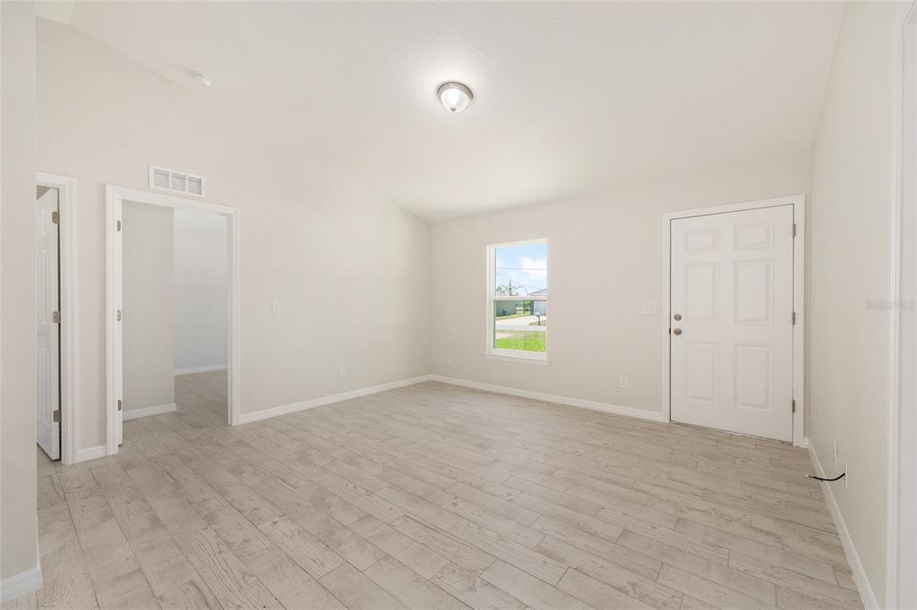 29 Olive Cir Loop Ocala, FL 34472 - Photo 16 of 49 a view of an empty room with a window