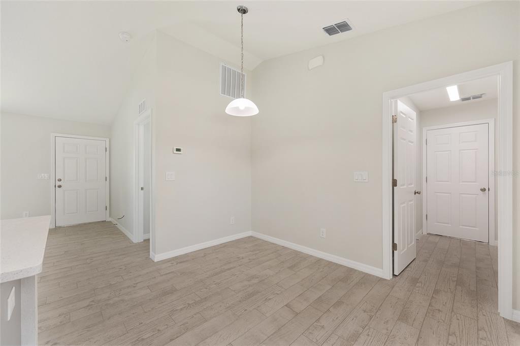 29 Olive Cir Loop Ocala, FL 34472 - Photo 18 of 49 a view of a room with wooden floor and white walls