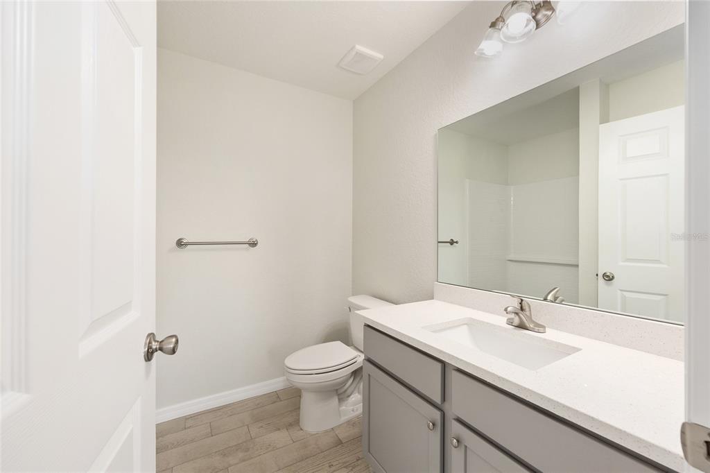 29 Olive Cir Loop Ocala, FL 34472 - Photo 25 of 49 a bathroom with a sink toilet and vanity