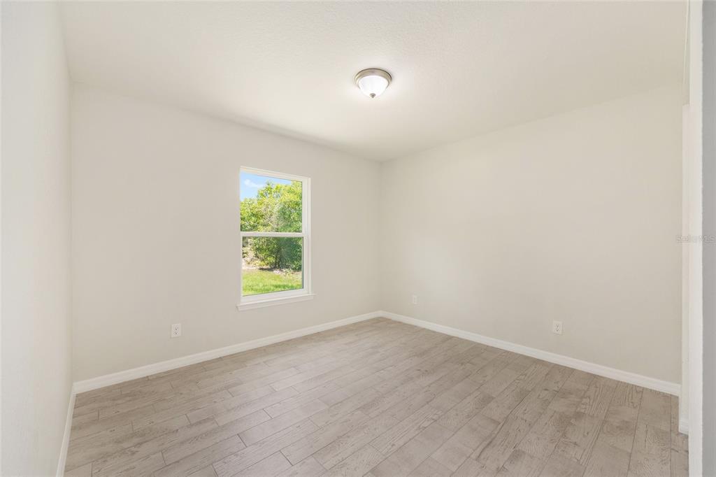 29 Olive Cir Loop Ocala, FL 34472 - Photo 29 of 49 a view of room with window and hardwood floor