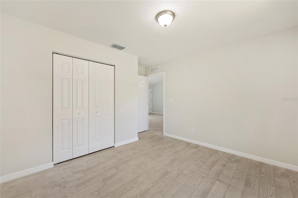 29 Olive Cir Loop Ocala, FL 34472 - Photo 30 of 49 an empty room with an entryway