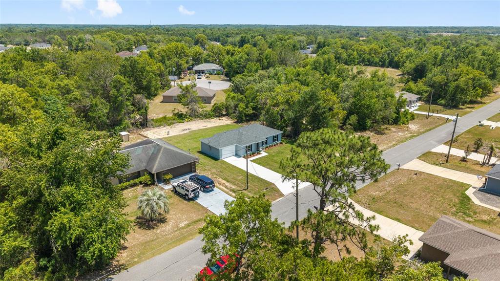 29 Olive Cir Loop Ocala, FL 34472 - Photo 35 of 49 an aerial view of a house with yard