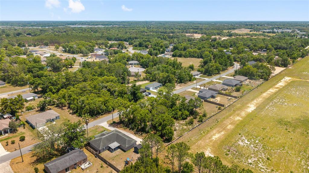 29 Olive Cir Loop Ocala, FL 34472 - Photo 38 of 49 an aerial view of residential houses with outdoor space and trees