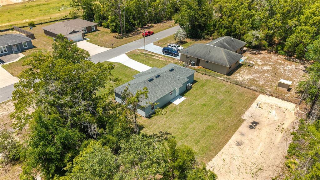 29 Olive Cir Loop Ocala, FL 34472 - Photo 43 of 49 an aerial view of residential house with swimming pool