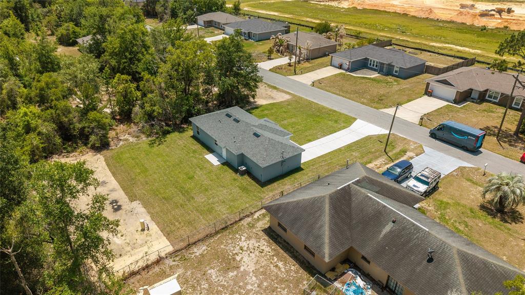 29 Olive Cir Loop Ocala, FL 34472 - Photo 44 of 49 an aerial view of residential houses with outdoor space