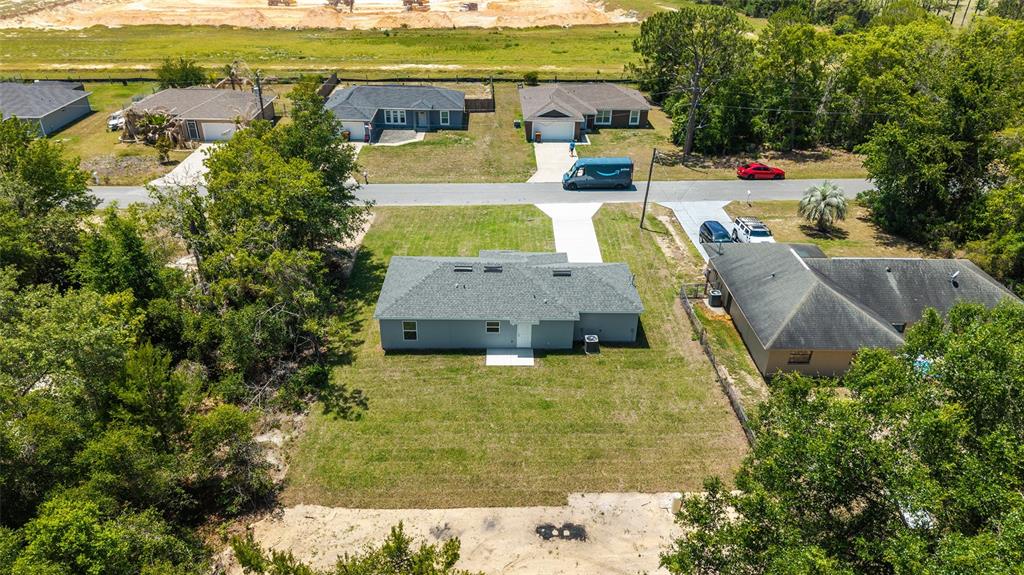 29 Olive Cir Loop Ocala, FL 34472 - Photo 45 of 49 an aerial view of residential houses with outdoor space and swimming pool