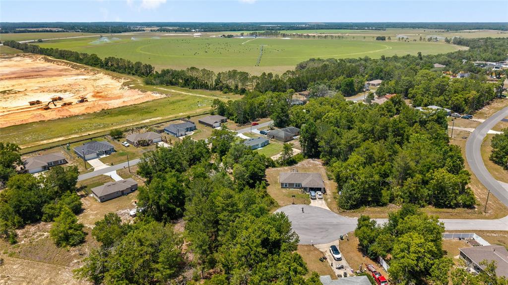 29 Olive Cir Loop Ocala, FL 34472 - Photo 48 of 49 an aerial view of residential building with outdoor space and lake view