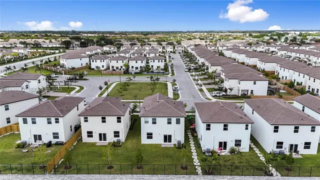 a view of multiple houses with a yard