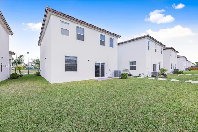 a view of a yard in front of a house