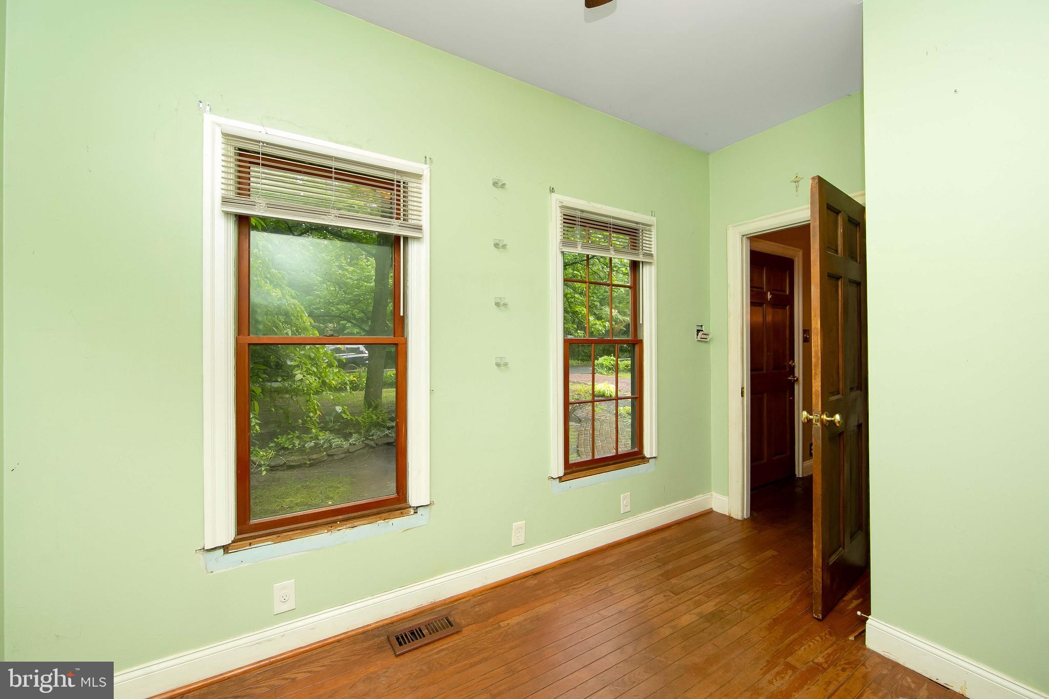 51 E Road Gibbsboro, NJ 08026 - Photo 17 of 42 a view of an empty room with wooden floor and a window