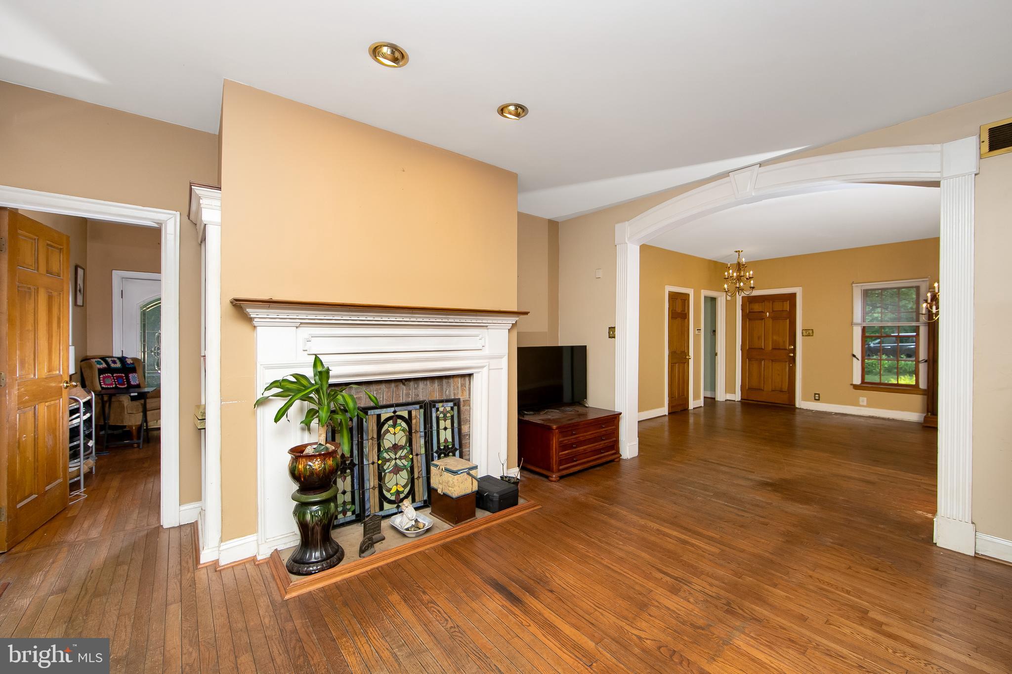 51 E Road Gibbsboro, NJ 08026 - Photo 19 of 42 a view of an empty room with wooden floor and a fireplace