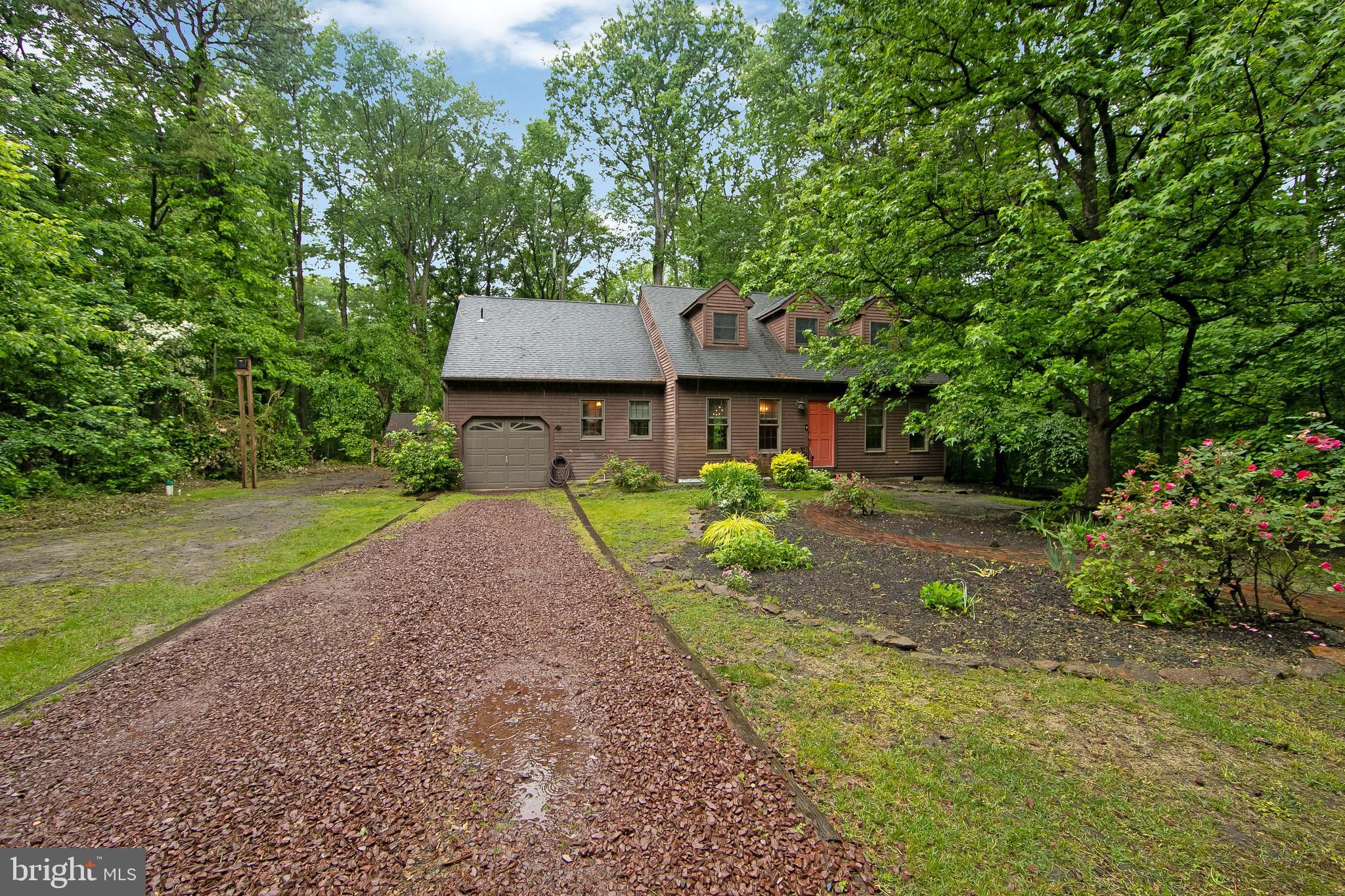 51 E Road Gibbsboro, NJ 08026 - Photo 2 of 42 a front view of a house with a garden