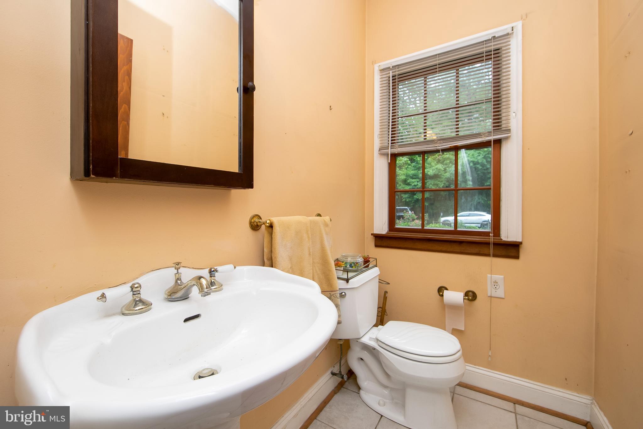 51 E Road Gibbsboro, NJ 08026 - Photo 27 of 42 a bathroom with a sink a toilet and mirror