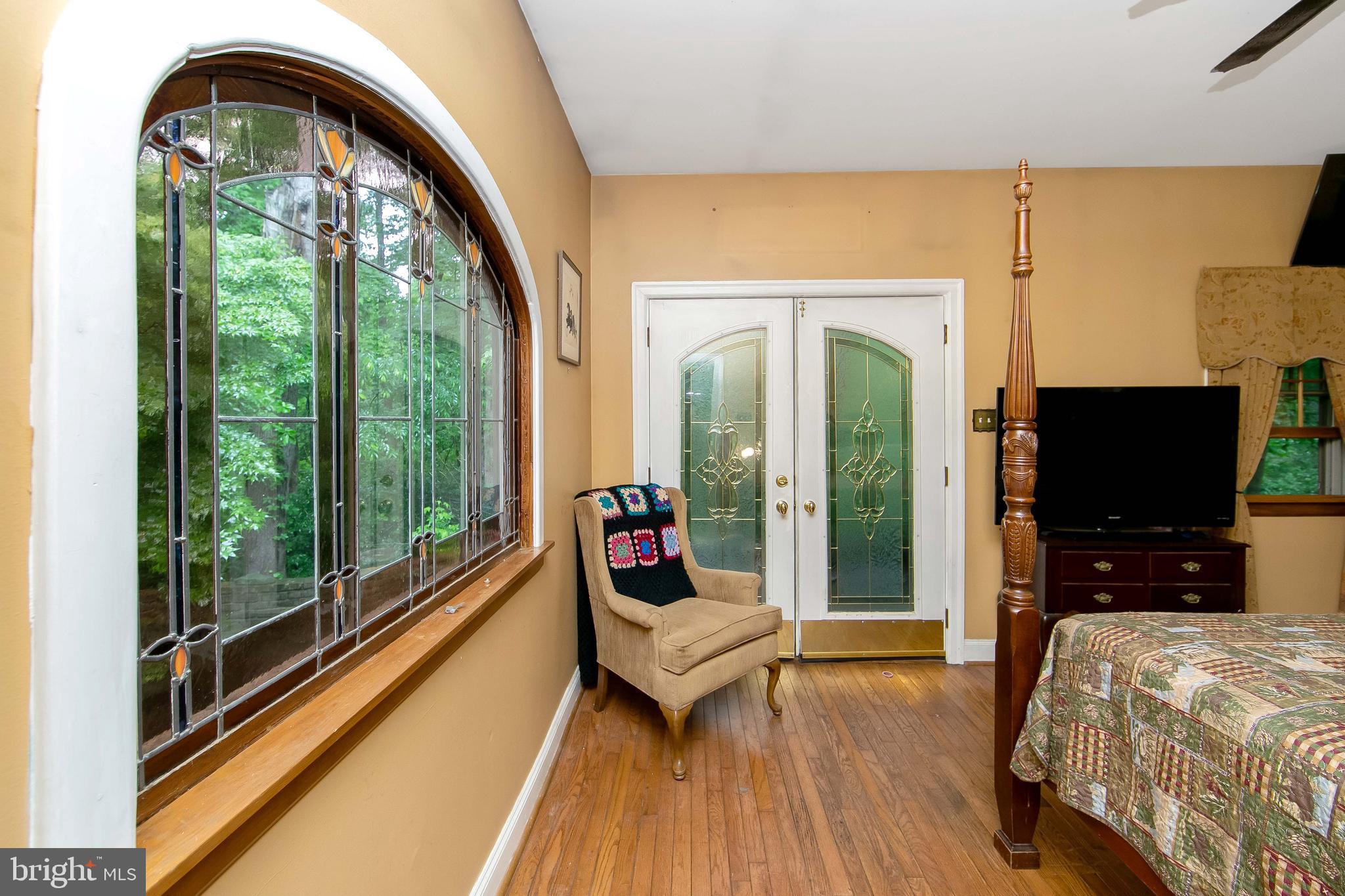 51 E Road Gibbsboro, NJ 08026 - Photo 29 of 42 a living room with furniture tv and a floor to ceiling window