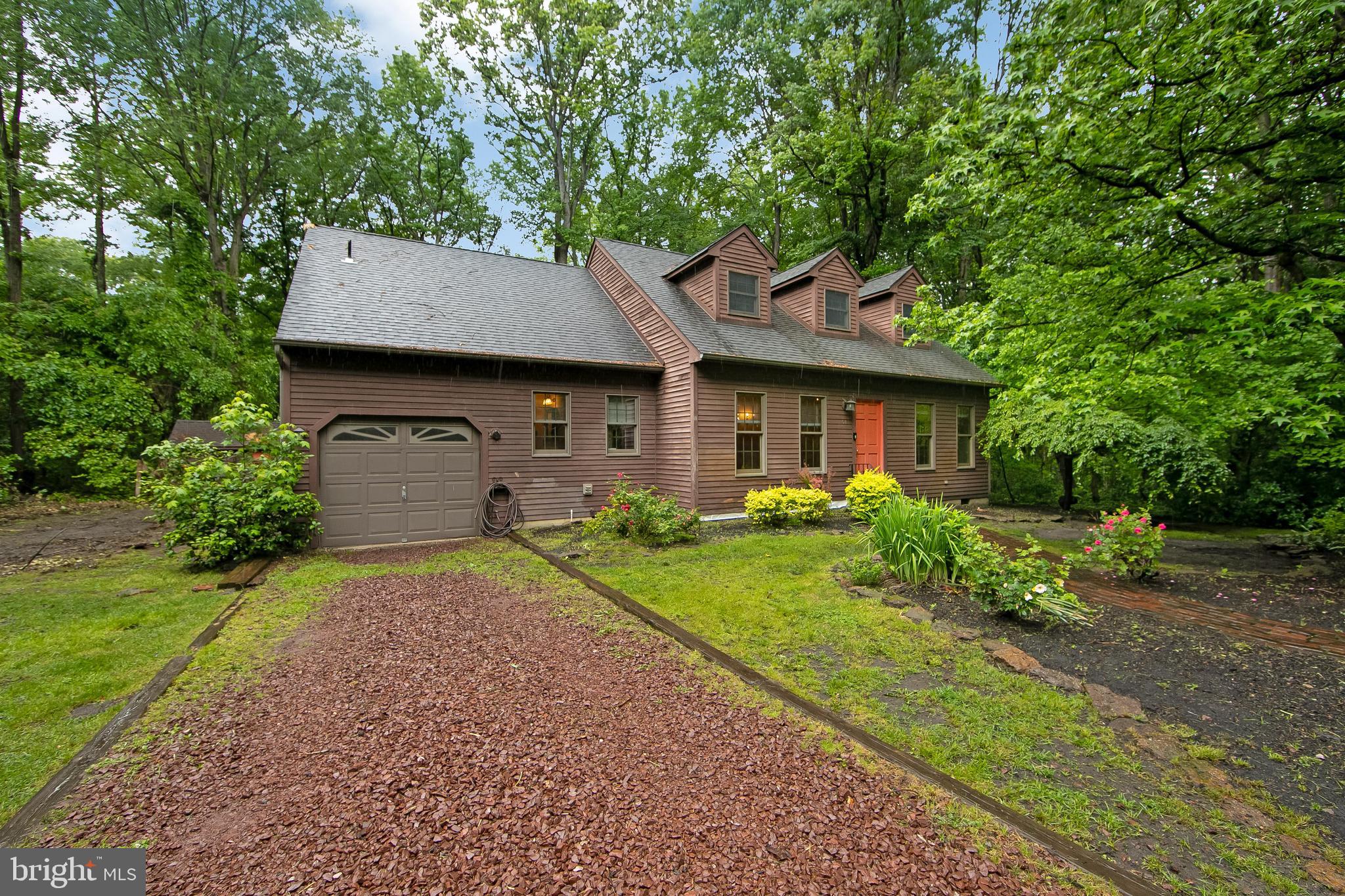 51 E Road Gibbsboro, NJ 08026 - Photo 3 of 42 a front view of a house with a yard and garage