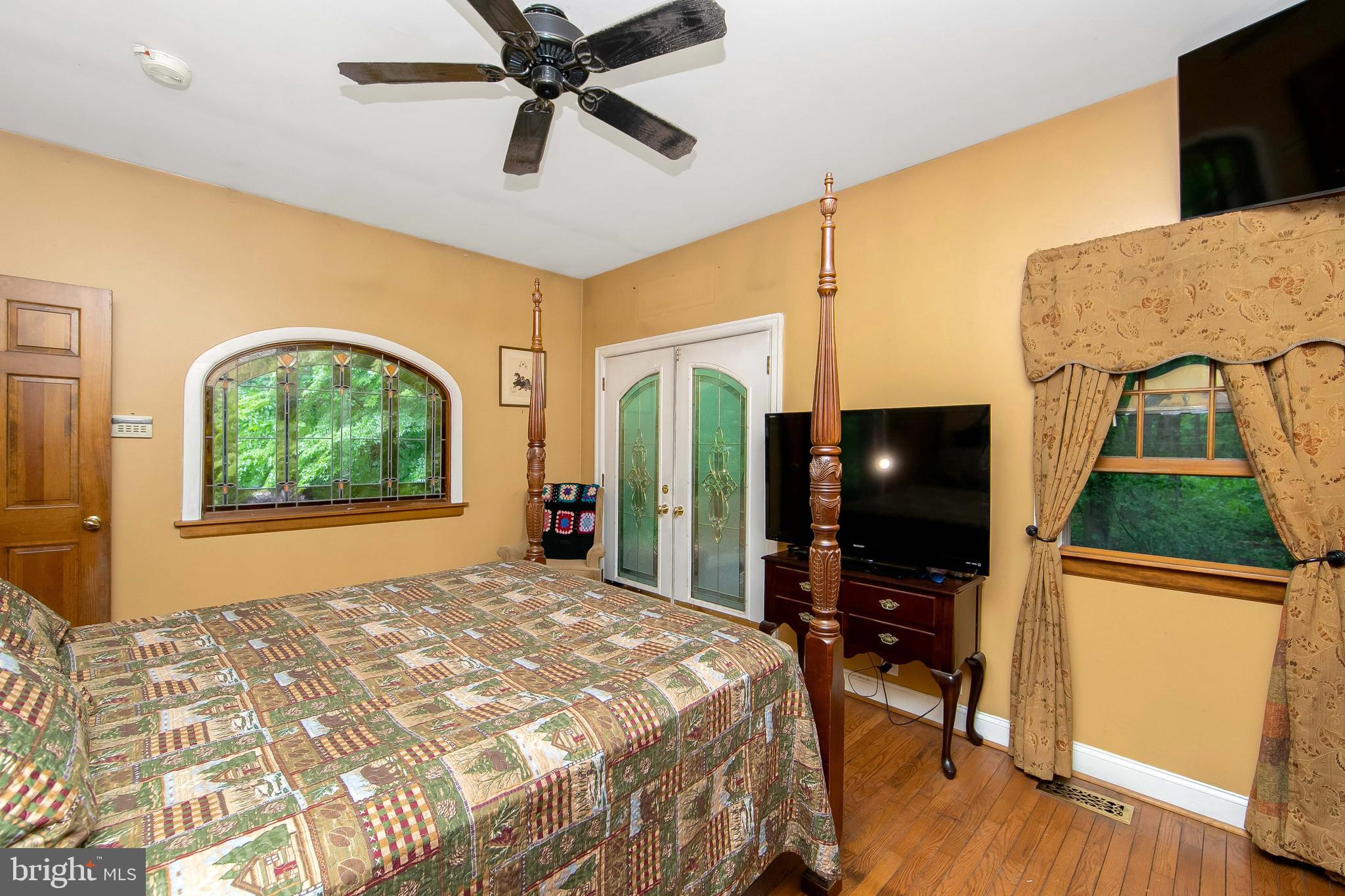 51 E Road Gibbsboro, NJ 08026 - Photo 31 of 42 a bedroom with a bed and a flat screen tv