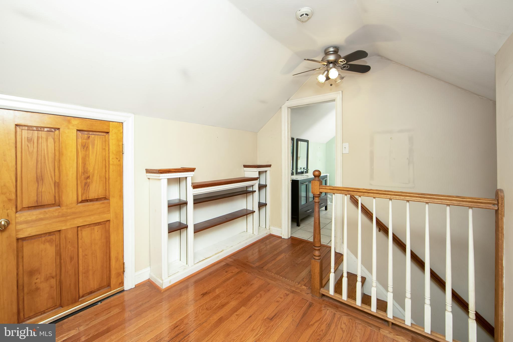 51 E Road Gibbsboro, NJ 08026 - Photo 33 of 42 a view of a hallway with wooden floor and staircase
