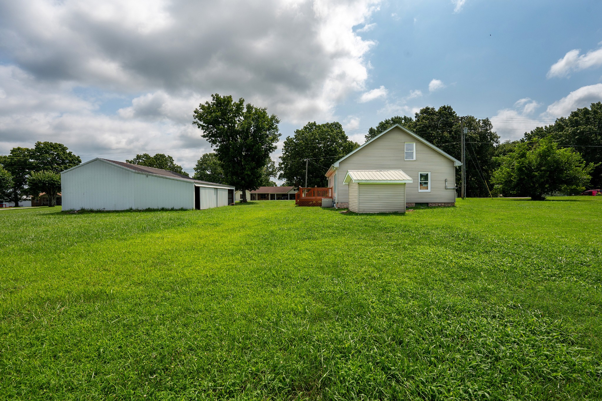 847 Chaffin Road Lafayette, TN 37083 - Photo 27 of 42 a view of a house with a yard and a tree