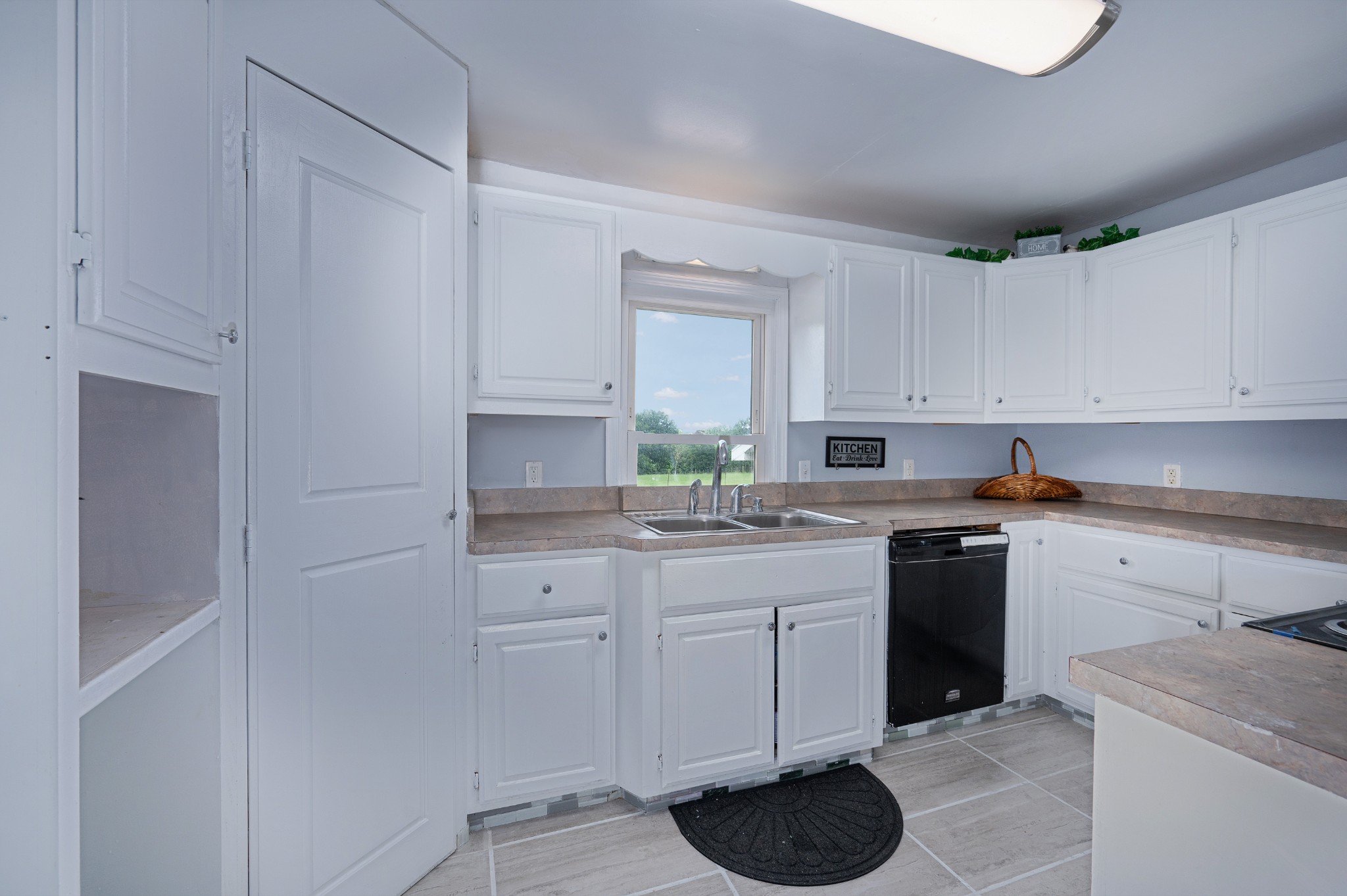 847 Chaffin Road Lafayette, TN 37083 - Photo 5 of 42 a kitchen with a sink cabinets and window