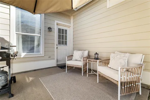 a view of a patio with a table and chairs