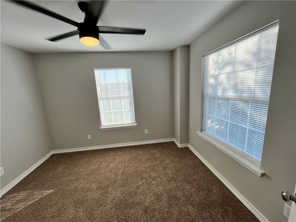 908 East Hefferman Street Beeville, TX 78102 - Photo 34 of 40 a view of an empty room with a window