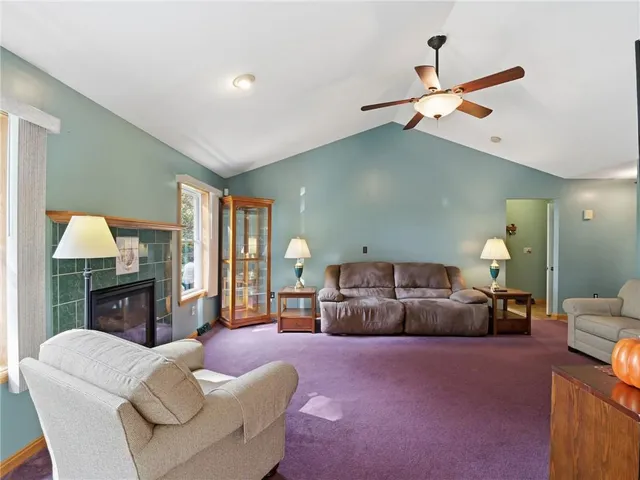 a living room with furniture and a lamp