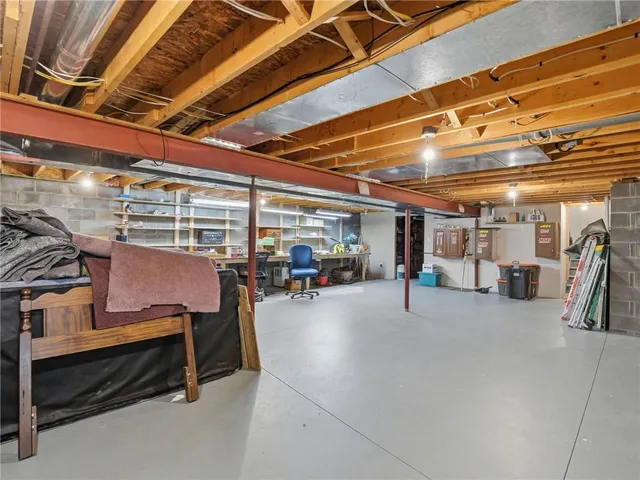 a room with wooden furniture and a table
