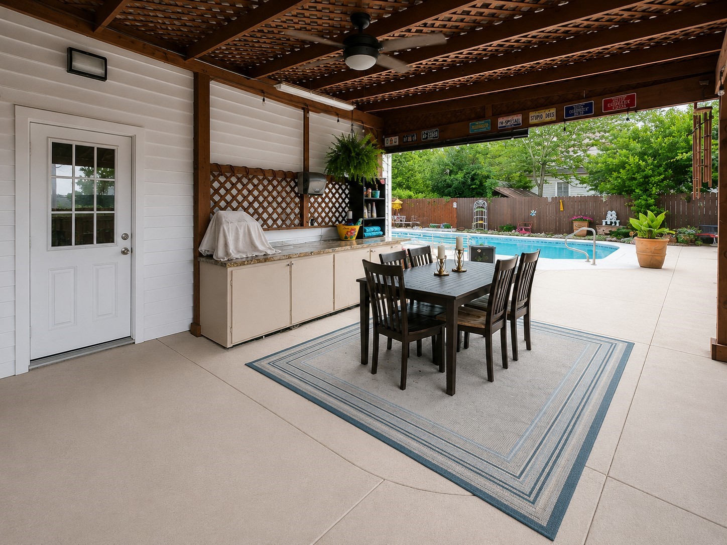 416 Division Street Jewett, TX 75846 - Photo 22 of 38 a view of a patio with a table chairs and a backyard
