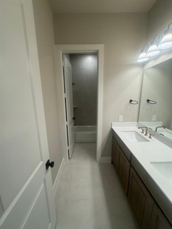 412 Indian Crk Road Van Alstyne, TX 75495 - Photo 19 of 24 a bathroom with a sink a toilet and shower