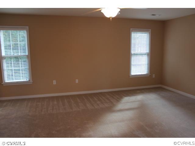 839 Club Ridge Court Chester, VA 23836 - Photo 9 of 24 a view of an empty room with a window