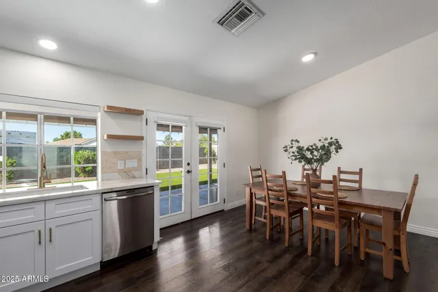 a view of a dining room with furniture and windows