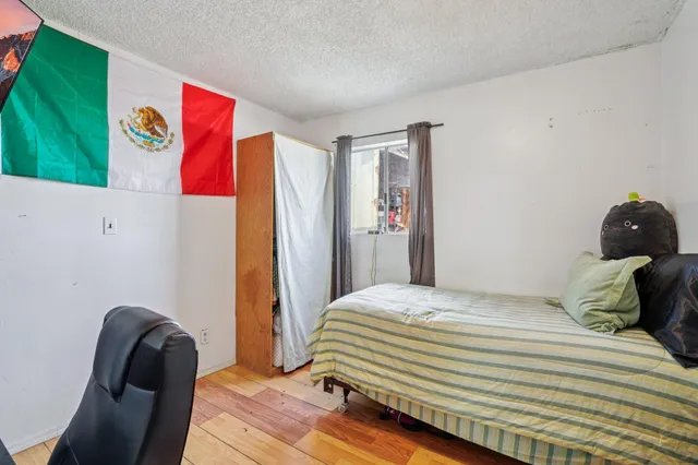 a spacious bathroom with a granite countertop sink and a mirror
