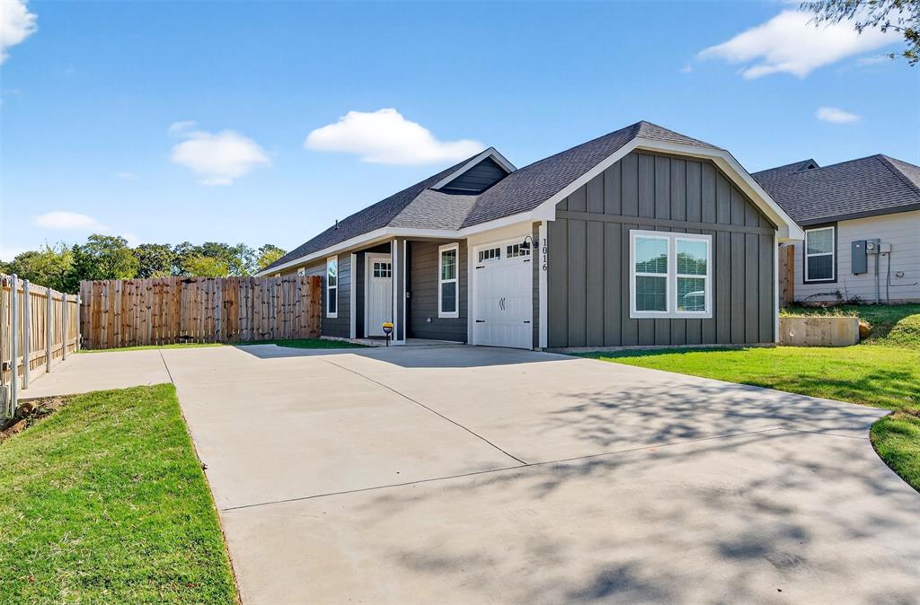 1016 Ray Drive Denison, TX 75020 - Photo 1 of 7 a house view with a garden space