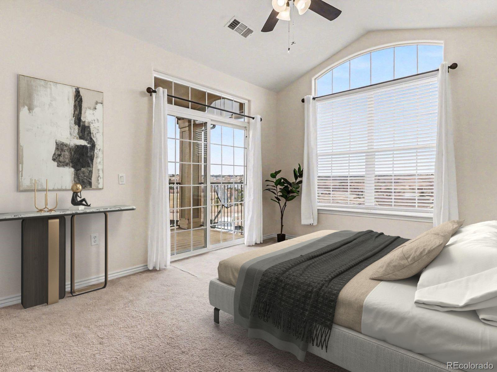 18611 Stroh Road, Unit 5208 Parker, CO 80134 - Photo 11 of 27 a bedroom with a large bed and a window