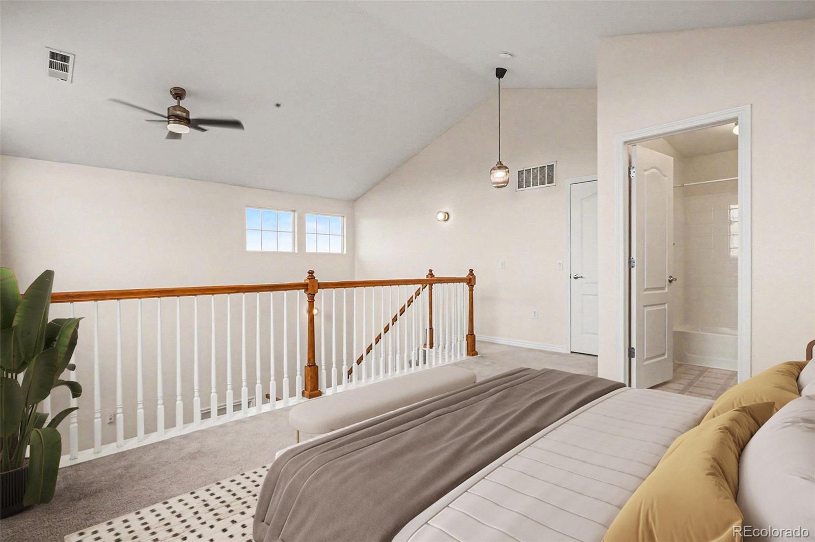 18611 Stroh Road, Unit 5208 Parker, CO 80134 - Photo 20 of 27 a bedroom with a bed and a tv