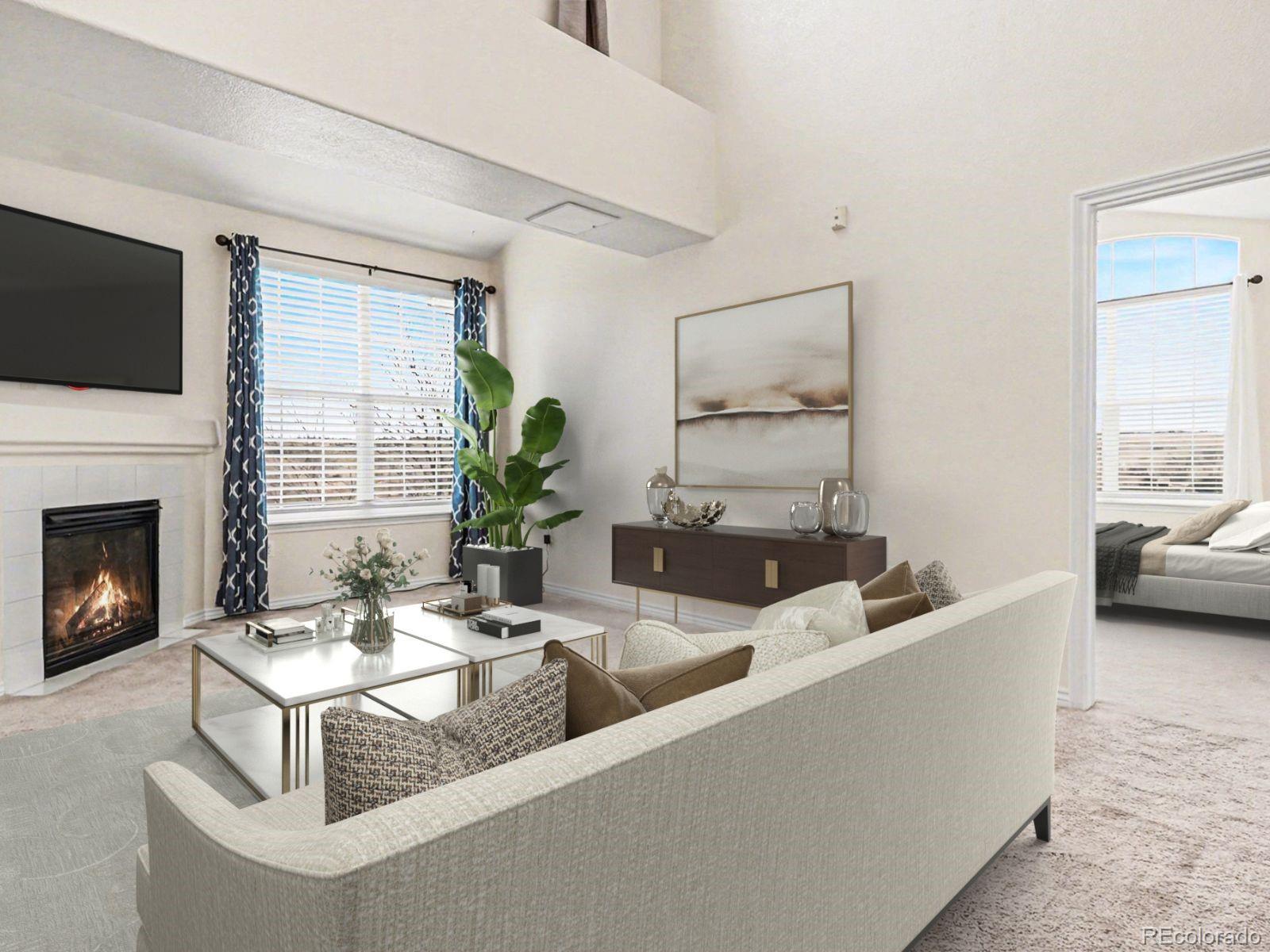 18611 Stroh Road, Unit 5208 Parker, CO 80134 - Photo 4 of 27 a living room with furniture a fireplace and a flat screen tv