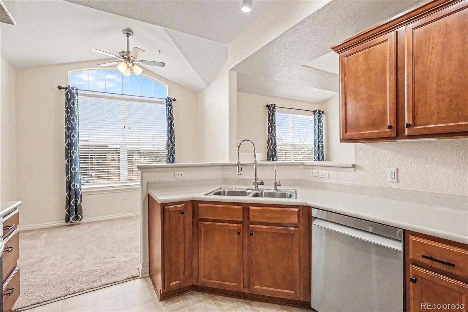 18611 Stroh Road, Unit 5208 Parker, CO 80134 - Photo 8 of 27 a kitchen with a sink cabinets and window