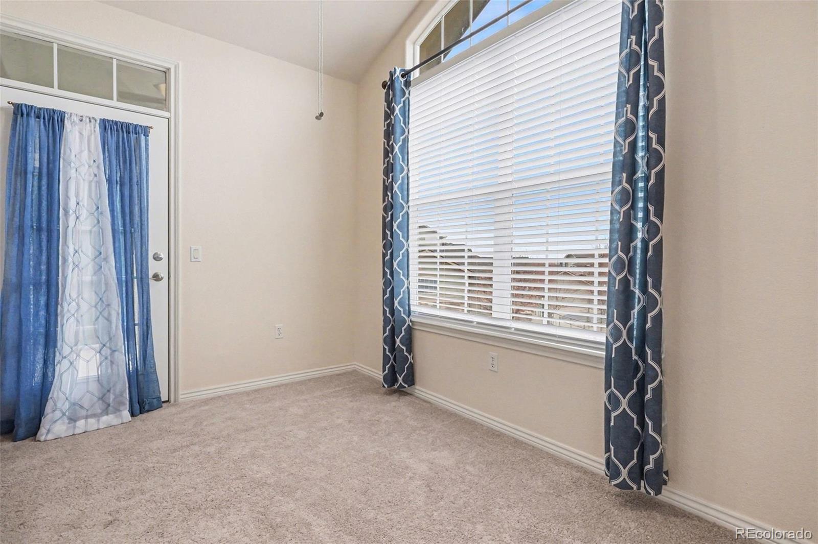 18611 Stroh Road, Unit 5208 Parker, CO 80134 - Photo 10 of 27 a view of an empty room with a window